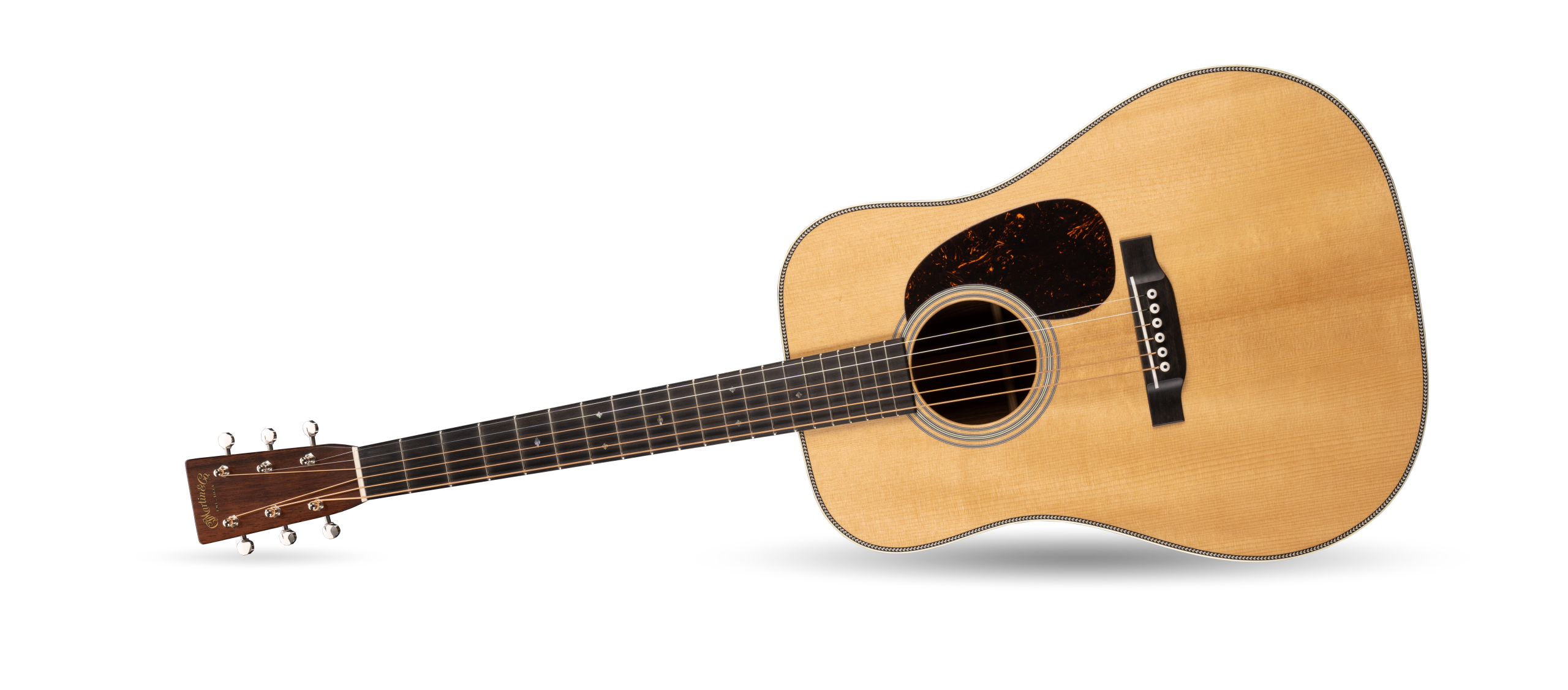 A Martin & Co guitar laying on its side